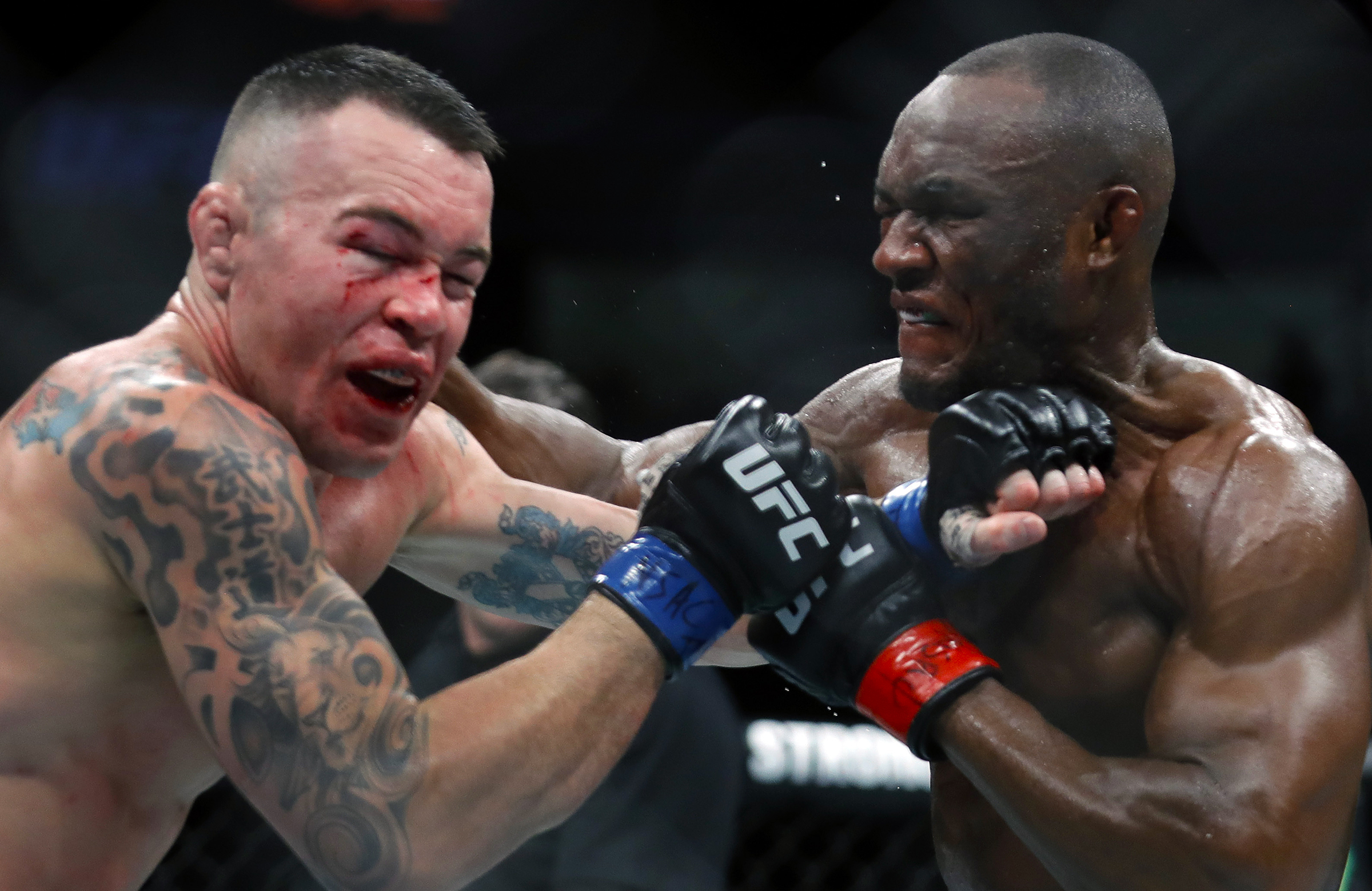 Usman and Covington during their first fight, in 2019.